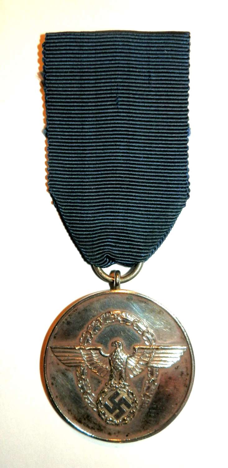 Police Loyal Service 3rd Class 8 Years Medal. Maker marked ‘24’.